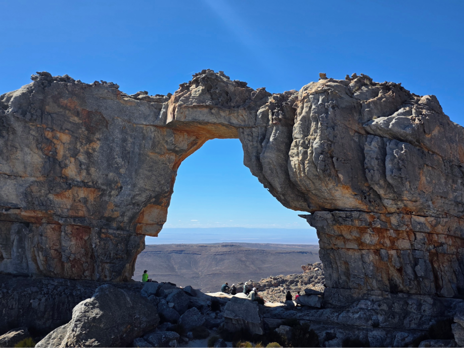 Small waterfall flowing through orange rock