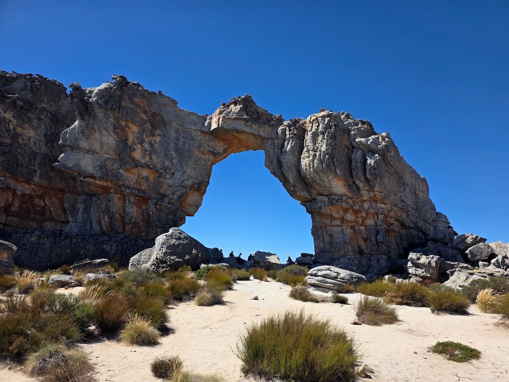 Small waterfall flowing through orange rock